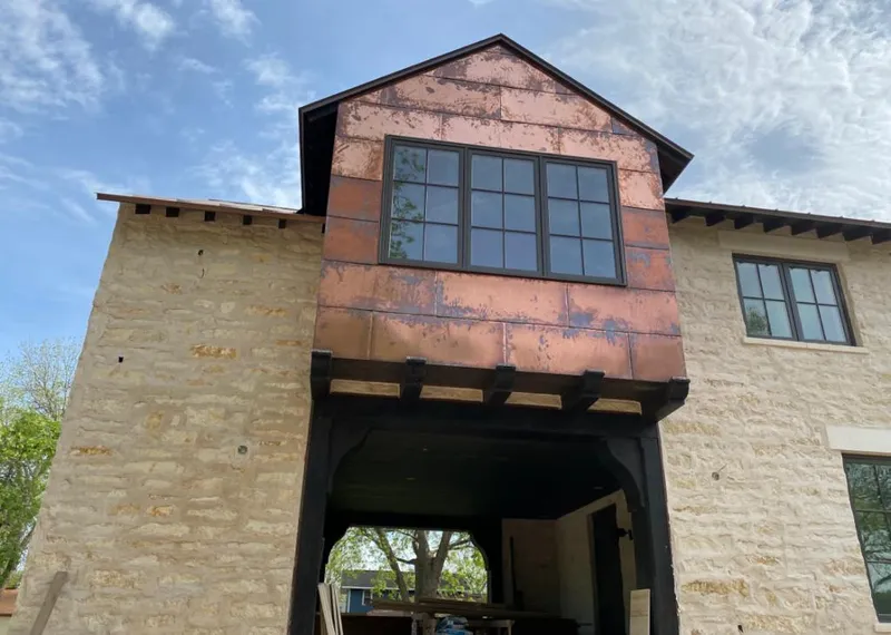 Copper metal panel facade on a stone building for Skylight Installation in Berkeley Heights